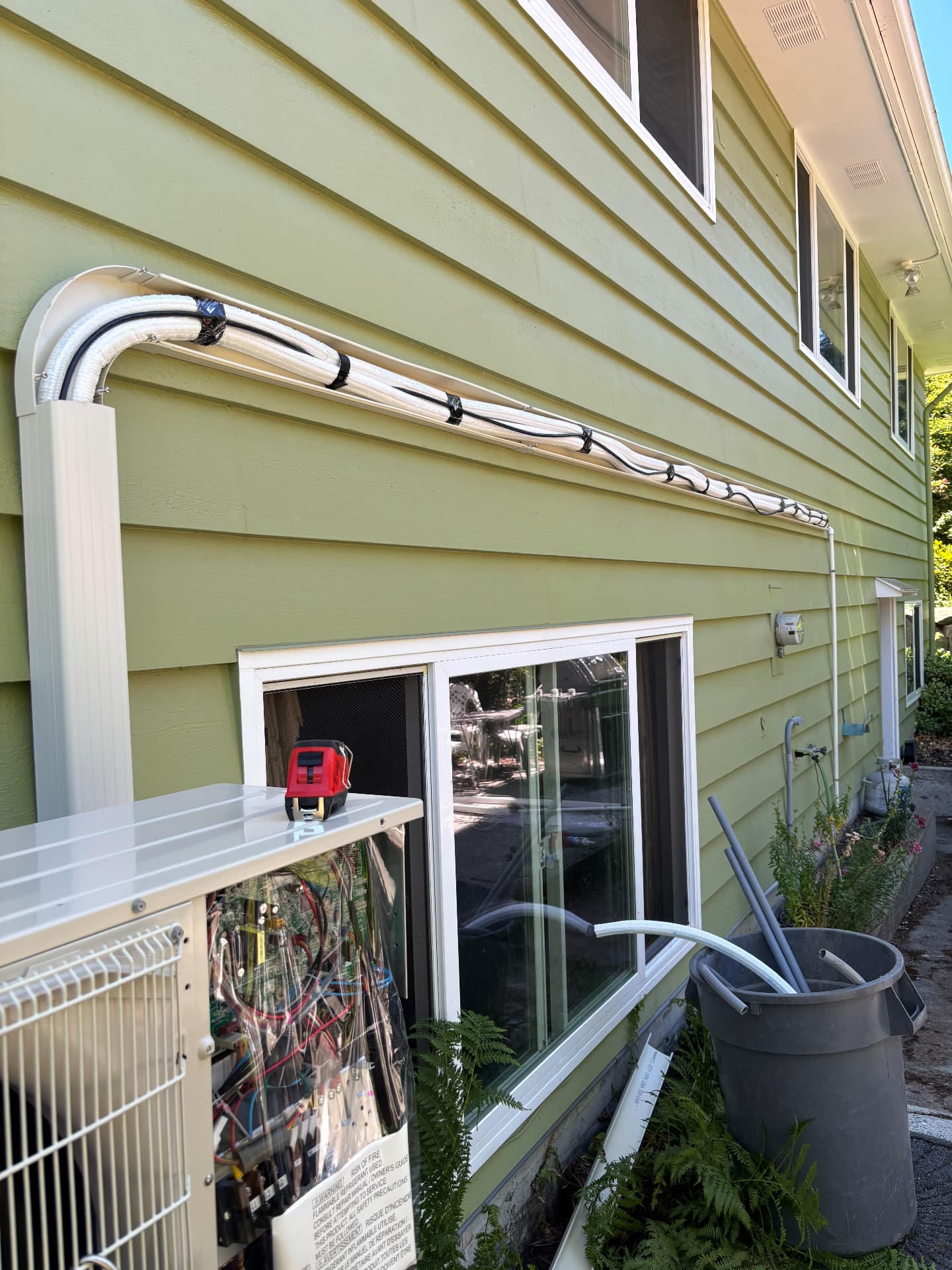 Line set and conduit run neatly along a home exterior