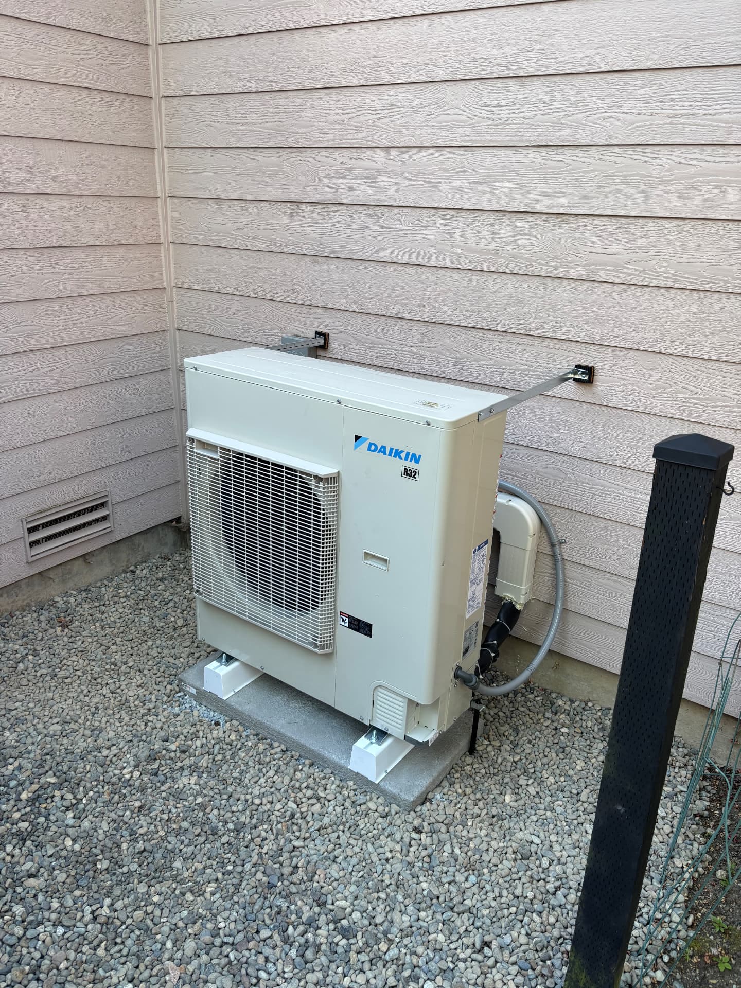 Daikin outdoor unit installed on a concrete pad